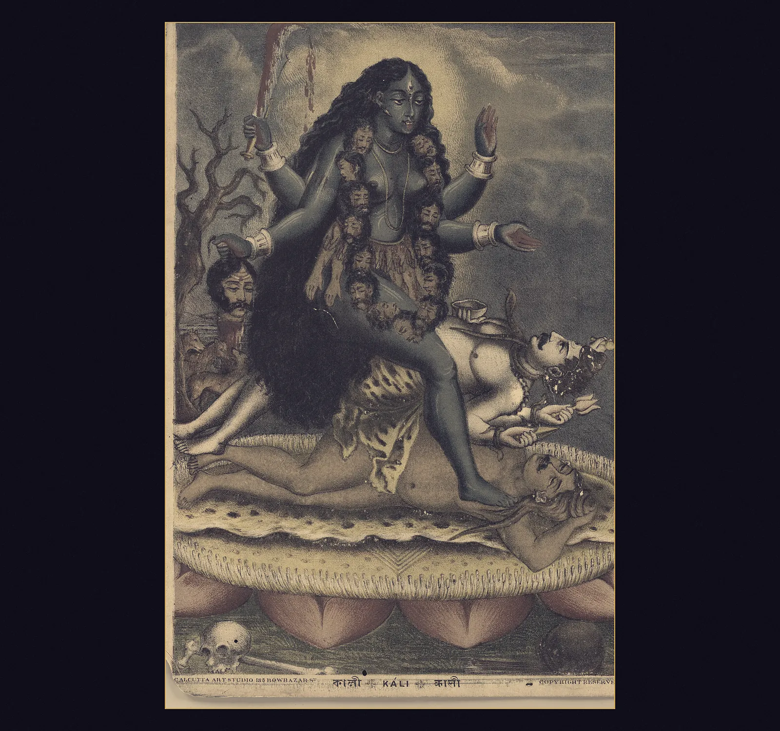 Kali standing on Shiva on a lotus, four-armed, holding a sword and a severed head in one pair of hands and making the fear-not and boon-giving gestures with the other