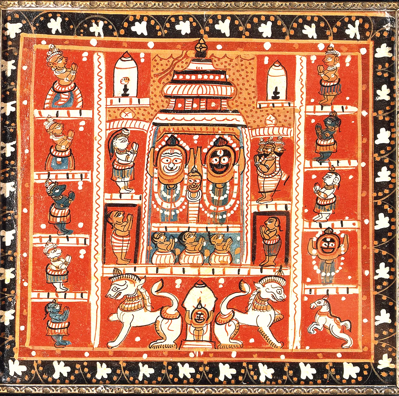 A Puri painting on a red ground showing Jagannatha, Balabhadra and Subhadra under a temple canopy in the centre, with two vertical columns of small niches on either side, each niche holding a separate deity.